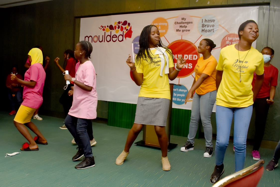 Teen girls dancing at Moulded Teens event